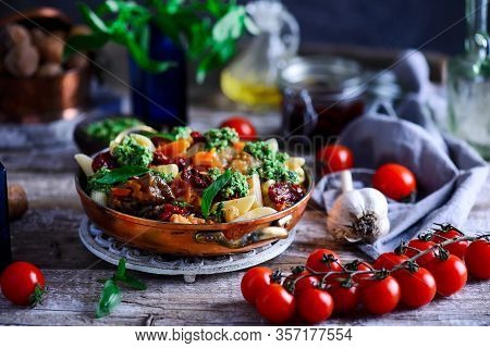 Pasta With Grilled Eggplant, Smoky Tomato Sauce And Basil Walnut Pistou. Style Vintage.selective Foc