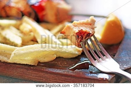 Close Up Of Traditional Greek Souvlaki With Chicken And Potatoes - Greek Kontosouvli - Greek Cuisine
