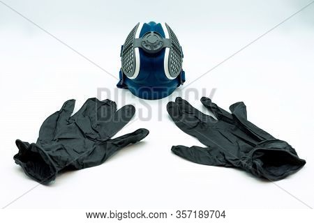Horizontal View Of Black Nitrite Gloves And Coronavirus Mask, Isolated On A White Background. Virus 