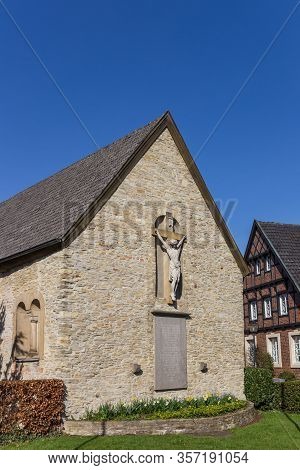 Statue Of Jesus At The Facade Of The Petrikapelle In Freckenhorst, Germany