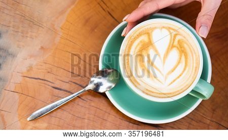 Design On Surface Of Latte. Challenge For Latte Artist. Top View Coffee Cup On Wooden Table. Beautif
