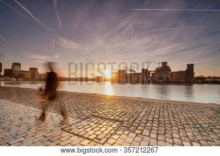 Rotterdam - 14 February 2019: Rotterdam, The Netherlands The Sun Rises Behind Several Old Industrial