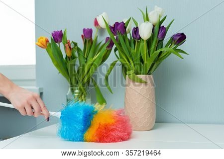 Housewife Wipes Dust With A Dust Brush During Spring Cleaning At Home. Household Chores And Housekee