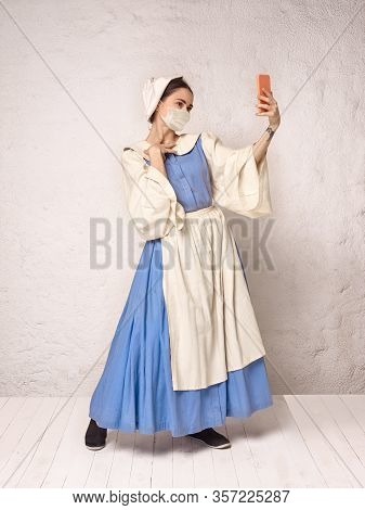 Medieval Young Woman As A Medieval Lady Milkmade Wearing Protective Face Mask Against Corovanirus Sp