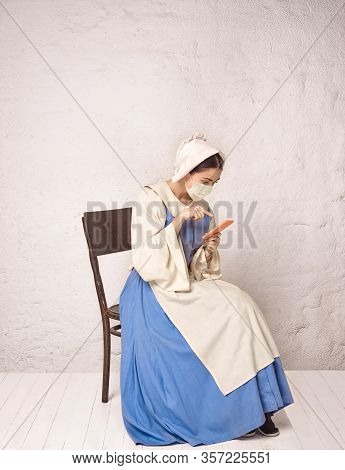 Medieval Young Woman As A Medieval Lady Milkmade Wearing Protective Face Mask Against Corovanirus Sp
