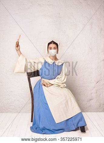 Medieval Young Woman As A Medieval Lady Milkmade Wearing Protective Face Mask Against Corovanirus Sp
