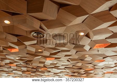 Lights Speakers Ventilation And Fire Sprinklers On Drop Ceiling Wooden Texture Tiles. Hexagon Metal 