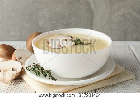 Mushroom Cream Soup On Wooden Background, Close Up