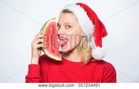 Christmas Summer Destinations. Christmas Girl Eat Watermelon. Woman Santa Hat Hold Slice Watermelon.