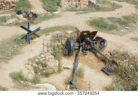 Sevastopol, Crimea - July, 2019: Trench Park. A Fragment Of The Defensive Line. 45 Mm Anti-tank Gun 