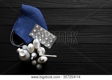 Coronavirus Prevention Medical Mask, Tablets And Other Therapeutic Agentscon Black Background. Text 