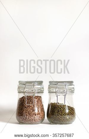 Mash And Red Lentils Are Tightly Closed In A Glass Bowl. Legumes Are Stored In Banks. Food Stocks Fo