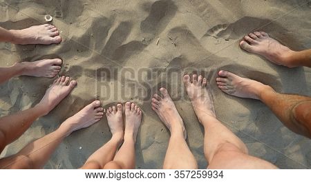 Ten Feet Fifty Toes Five People On The Sandy Beach In The Summer