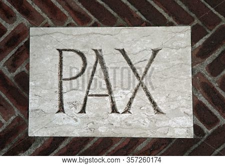 Large Pax Text Which Means Peace In Latin Language Engraved On The Tile Of The Floor Of An Ancient C