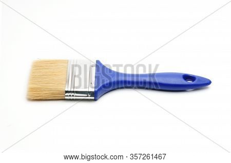 Blue Paint Brush On An Isolated White Background