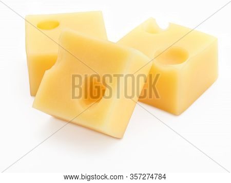 Portions (cubes, Dice) Of Emmental Swiss Cheese. Texture Of Holes And Alveoli. Isolated On White Bac