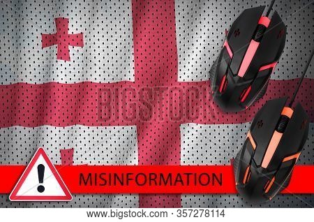 Georgia Flag And Two Computer Mouses. Misinformation During Coronavirus Or 2019-ncov Virus Concept
