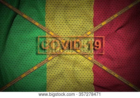 Mali Flag And Covid-19 Stamp With Orange Quarantine Border Tape Cross. Coronavirus Or 2019-ncov Viru