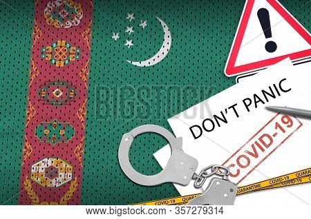Turkmenistan Flag And Police Handcuffs With Inscription Dont Panic On White Paper. Coronavirus Or 20