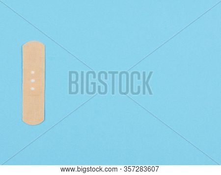 Band-aid  On A Blue Background. The View From The Top.