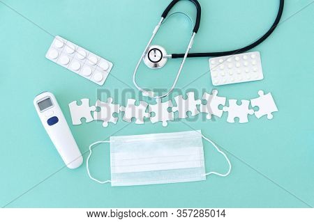 Top view of medical equipment and blank puzzle pieces