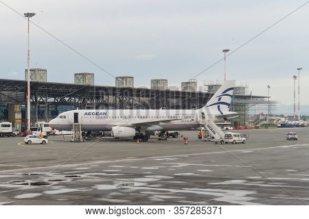 Thessaloniki, Greece - May 23 2018: Aegean Airlines Aircraft Grounded At Airport Tarmac. Greek Flag 