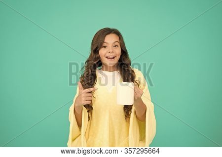 Starting Day With Breakfast. Small Kid Turquoise Background. Little Girl Drink Cocoa Or Milk Before 