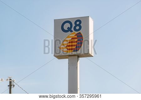 Sicily - February 11, 2020: The Logo Of Q8 Gas Station On A Banner Where Drivers Can Refuel Their Ca
