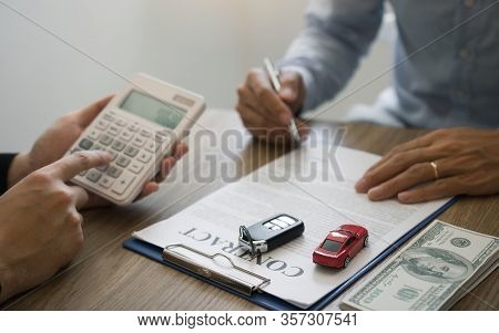 Finance Manager Of The Car Showroom Is Calculating The Cost Of Reserving A New Car For The Customer