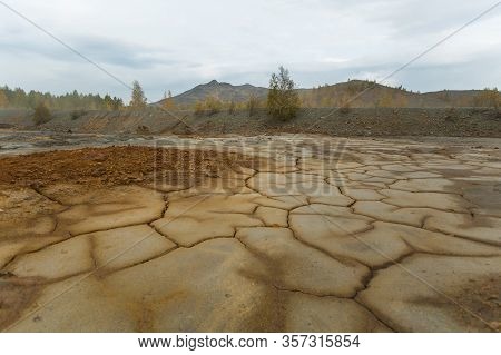 Landscape With Red Soil Polluted Copper Mining Factory In Karabash, Russia, Chelyabinsk Region