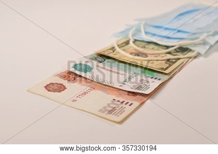 Medical Mask Lies On The Money Of Different Countries