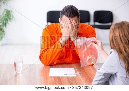 Young man meeting with advocate in pre-trial detention