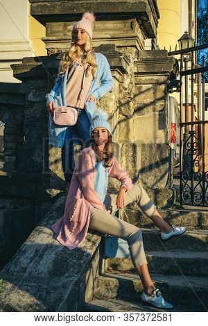 Beauty Fashion Photo Of Beautiful Blonde And Brunette Models Wearing Soft Pink And Blue Flufy Jamper