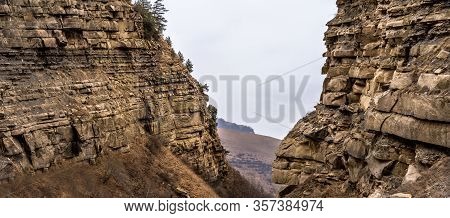 Rocks On Two Sides With A View Of The Plain