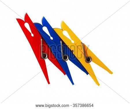 Three Various Plastic Clothespins On White Background