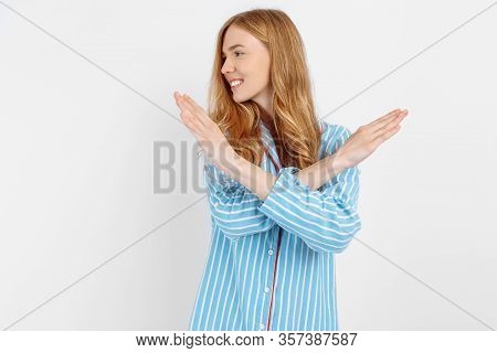 Beautiful Girl In Striped Pajamas, Doing Hands Crosswise, Forbidden, White Background, Concept: Girl