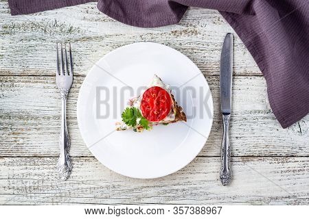 Pice Of Zucchini Cake With Tomatoes And Fresh Parsley On White Wooden Background.