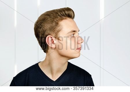 Portrait Of Young Guy With Pompadour Hairstyle. Side View.