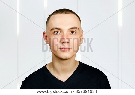 Portrait Of Young Guy With Caesar Hair Cut