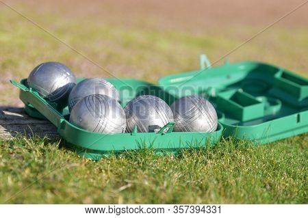 Petanque Balls In A Box On The Grass