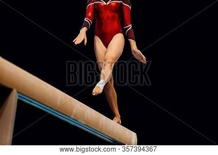 Women Balance Beam Artistic Gymnastics In Black Background