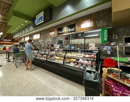 Orlando,fl/usa -3/7/20:  The Deli Counter Of A Publix Grocery Store With Colorful Sliced Meat And Ch