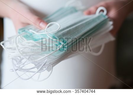 Human Hand Holding Medical Face Masks. Coronavirus Or Covid -19 Prevention. Clobal Pandemic. Virus S
