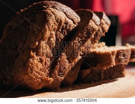 Sliced ​​black Rye Bread On A Wooden Board. Brick-shaped Bread.