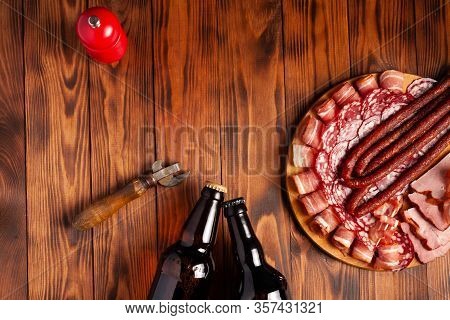 Beer Snack In The Form Of Meat Products And Bottled Beer. Appetizer In The Form Of Slicing Bacon, Sa