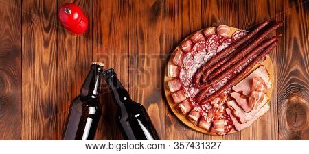 Beer Snack In The Form Of Meat Products And Bottled Beer. Appetizer In The Form Of Slicing Bacon, Sa