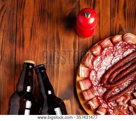 Beer Snack In The Form Of Meat Products And Bottled Beer. Appetizer In The Form Of Slicing Bacon, Sa