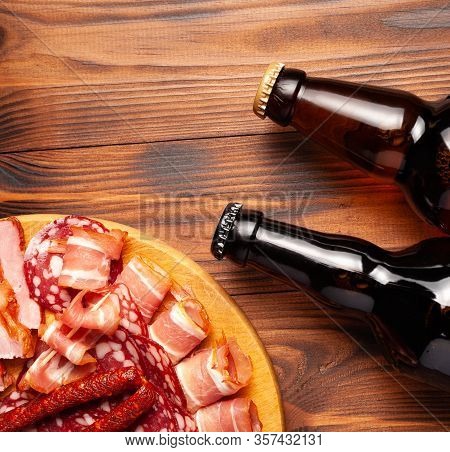 Beer Snack In The Form Of Meat Products And Bottled Beer. Appetizer In The Form Of Slicing Bacon, Sa