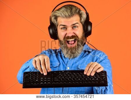 Feeling Of Excitement. Man Headphones And Keyboard. Professional Gamer Playing Computer Game. Chat O