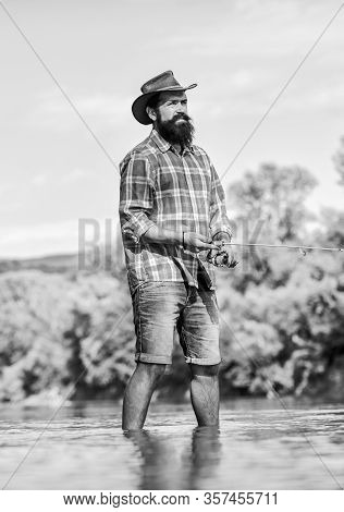 Gain Passion With Hobby. Sport Activity And Hobby. Experienced Fisher In Water. Successful Fly Fishi